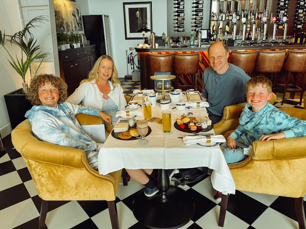 A family enjoying afternoon tea at the Titanic Hotel Belfast