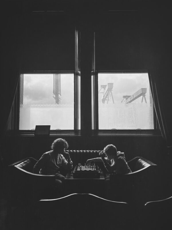 Two boys playing chess