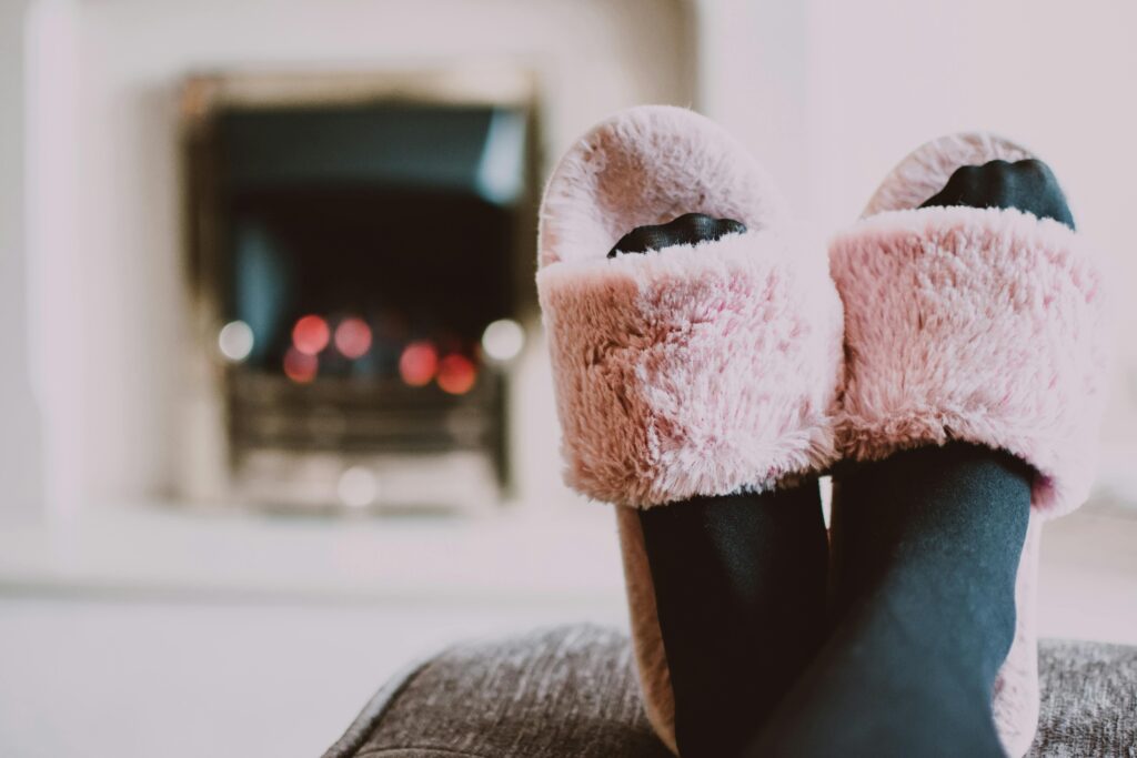 Slippers in front of a fireplace