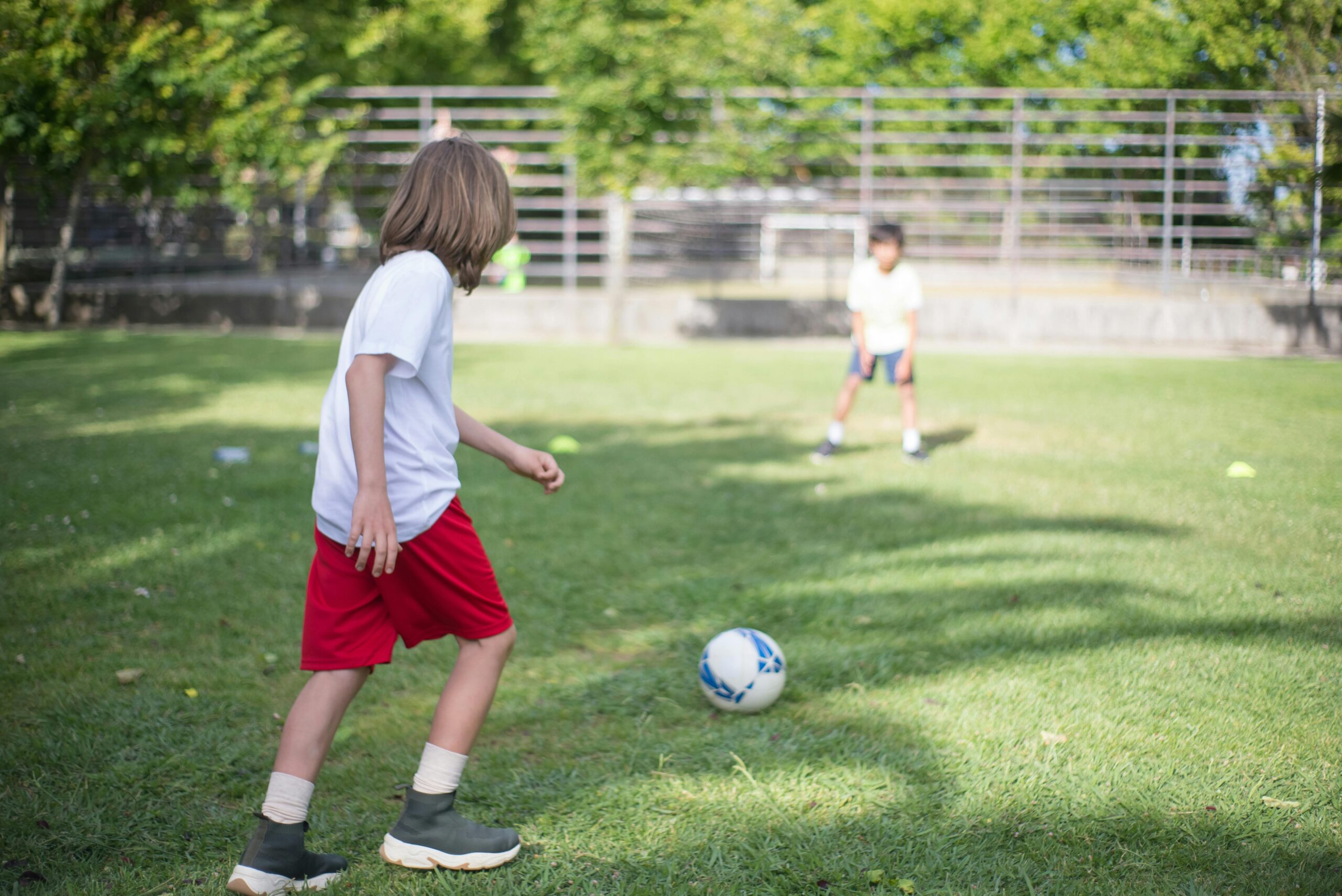 Two boys playing football