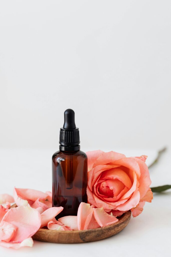 Hair oil surrounded by roses