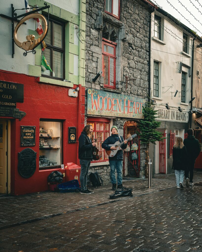 Two men playing instruments in Galway City