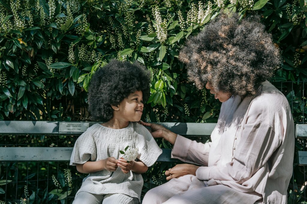 Mother talking to a child on a bench