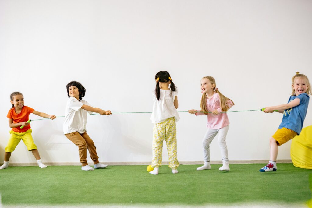 Group of children playing tug of war