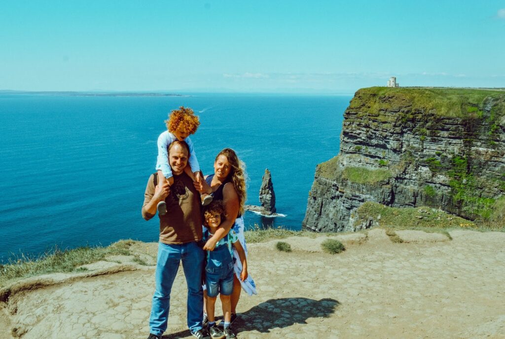 Family standing at the Cliffs of Moher
