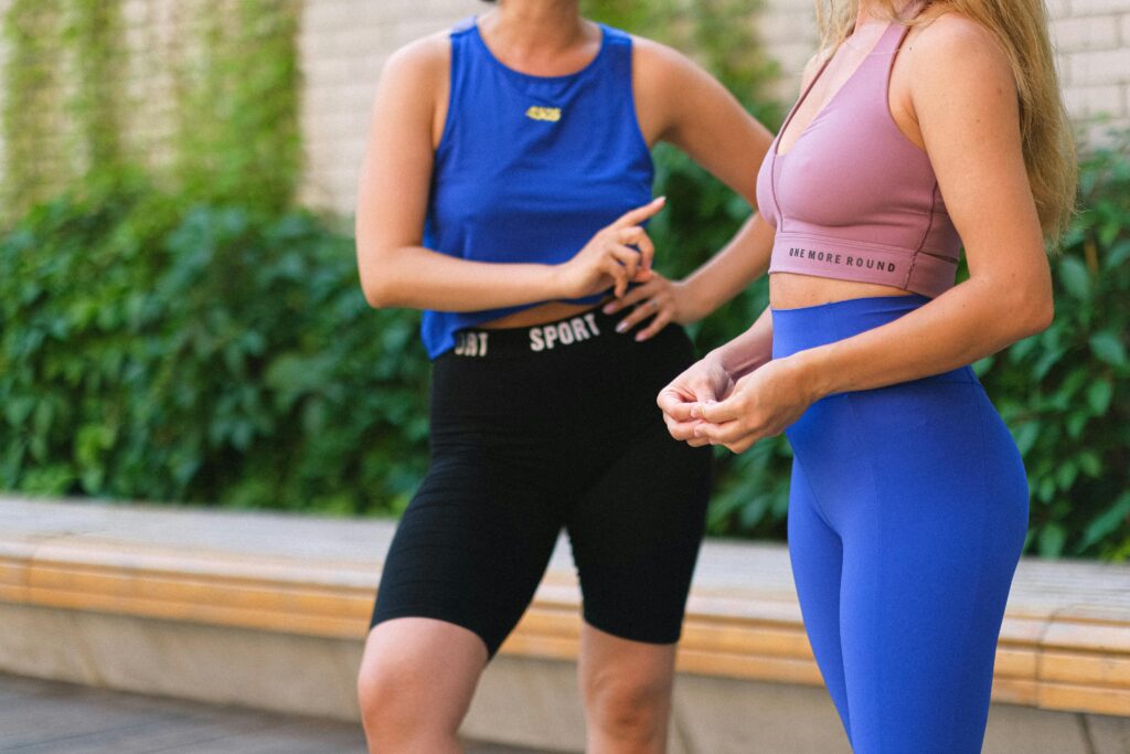 Anonymous women having a conversation in running clothing