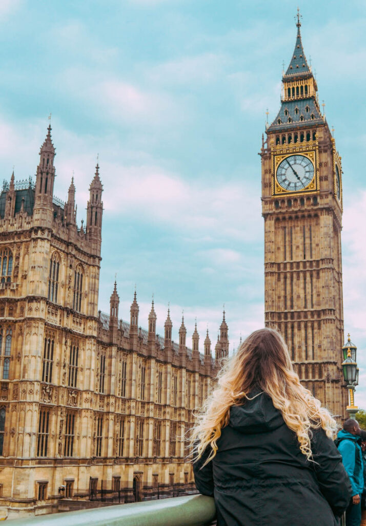 Woman looking at Big Ben in London