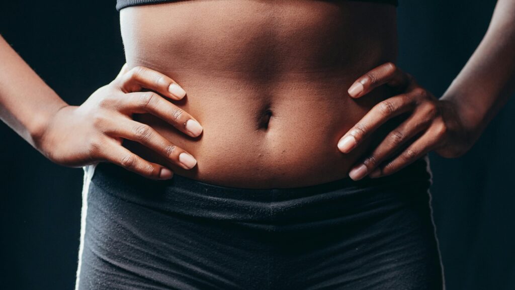 Hands on toned stomach
