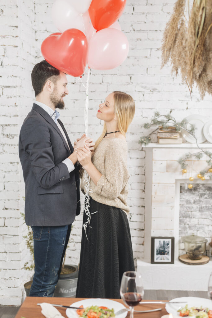 Happy couple with romantic balloons