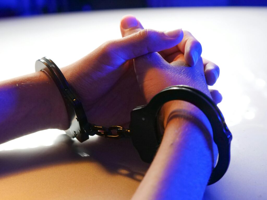 Handcuffs on hands