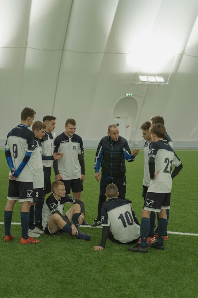 Coach motivating football team