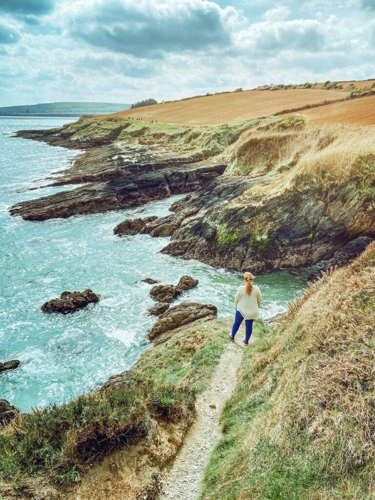 Woman standing on the Irish coastline