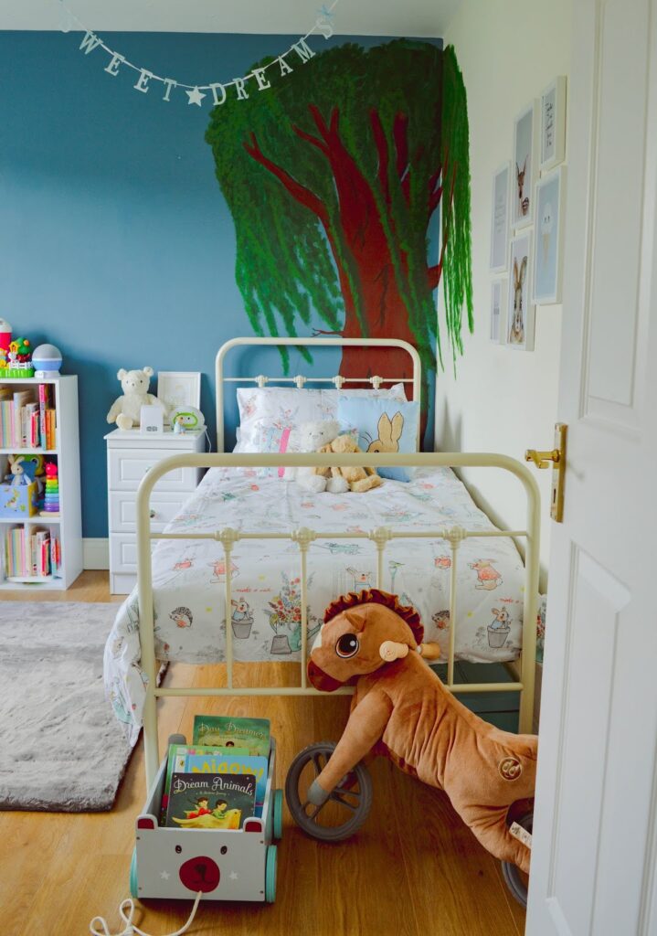 Child's bedroom with tree mural
