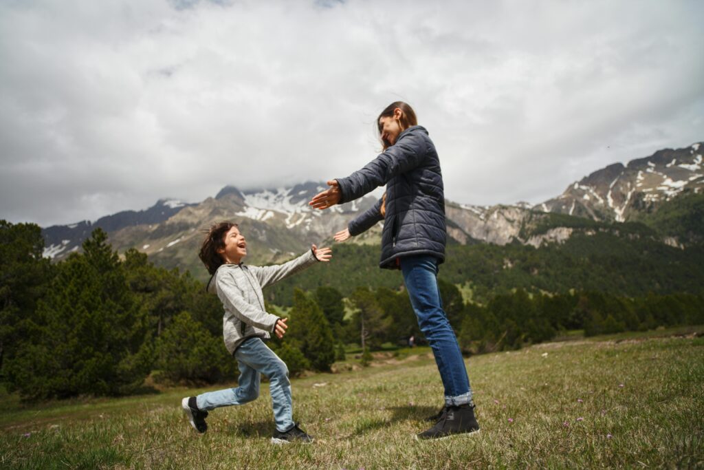 Child running to mother with open arms