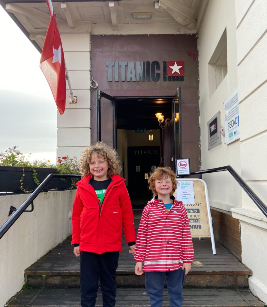 Two boys standing outside  The Titanic Experience, Cobh
