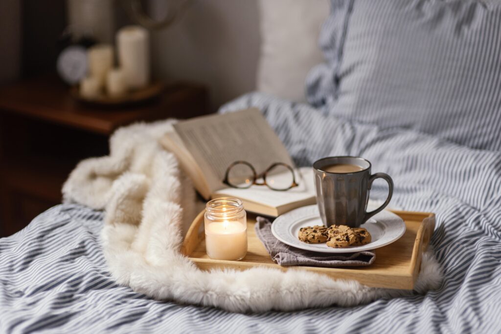 Cosy bedroom set up with tea and cookies