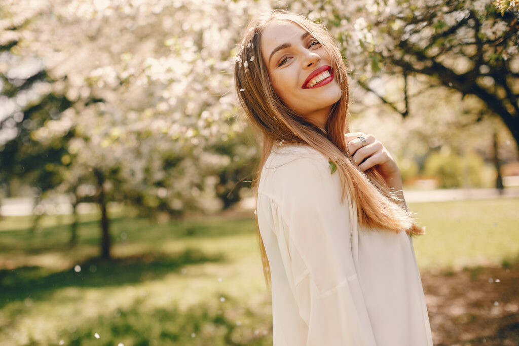 Woman smiling in a park in spring