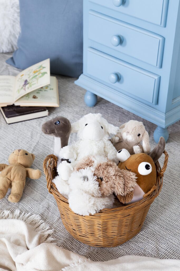 Child's cuddly toys in a storage basket