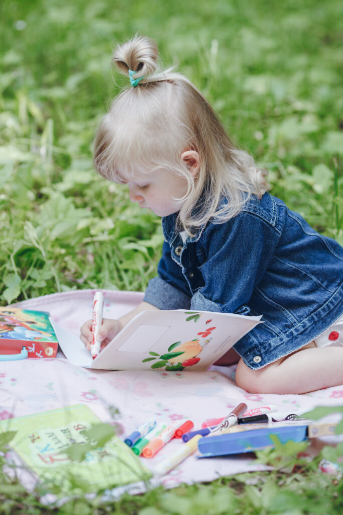 Young girl writing in a journal