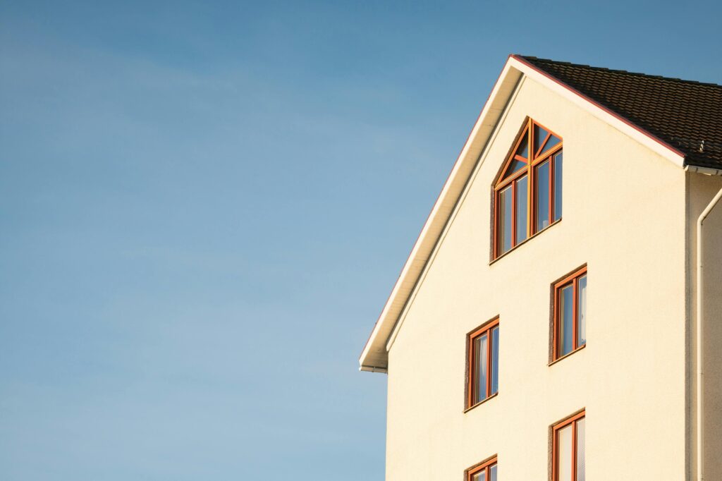 Beige house with multiple windows