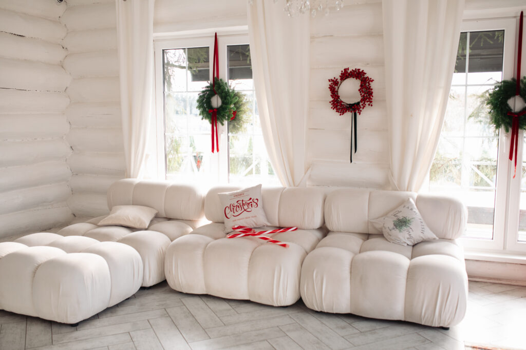 Modular couch in a room decorated for Christmas
