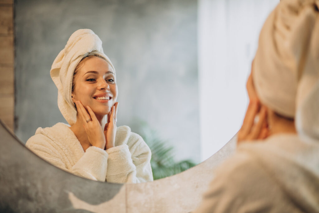Woman applying a face mask