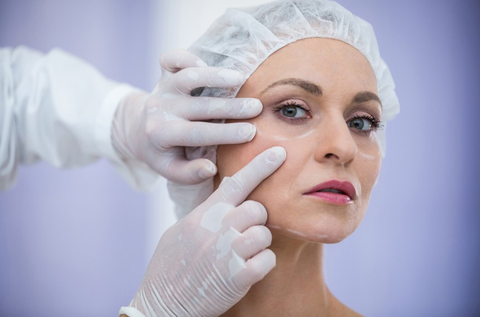Doctor examining patient for cosmetic treatment