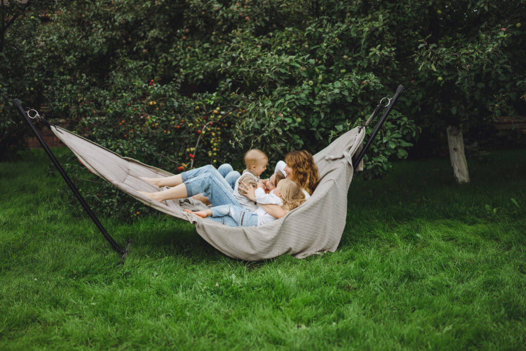 Mother and children sitting in a hammock