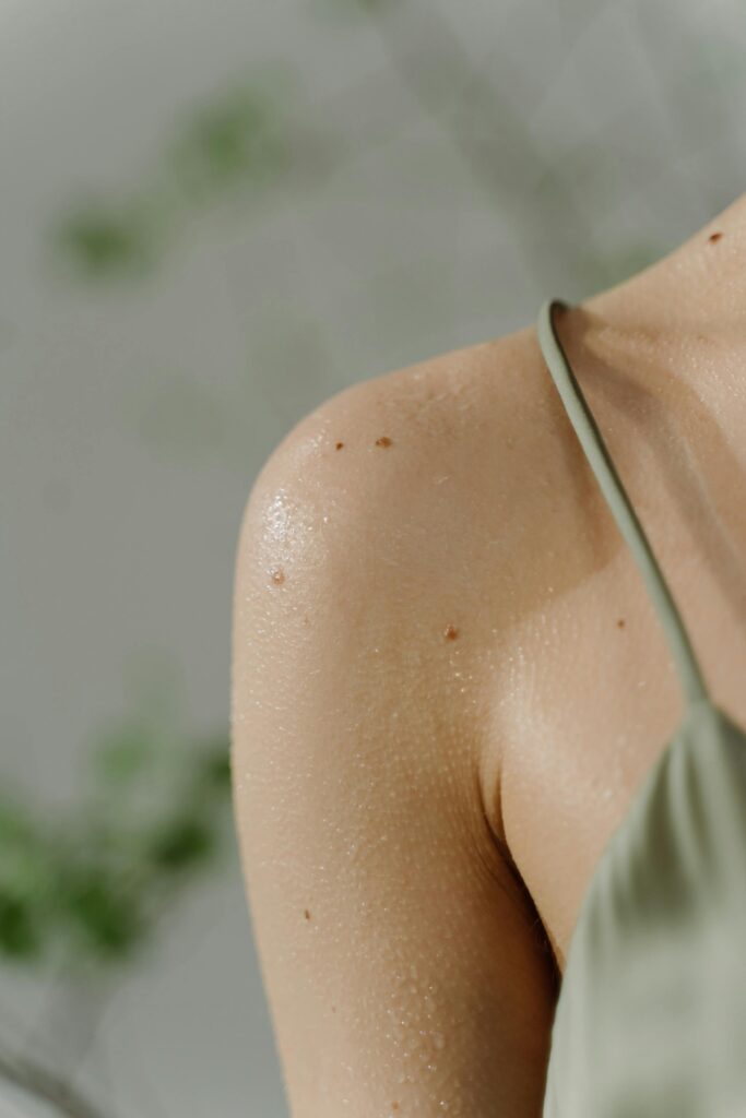 Woman in a green strappy top
