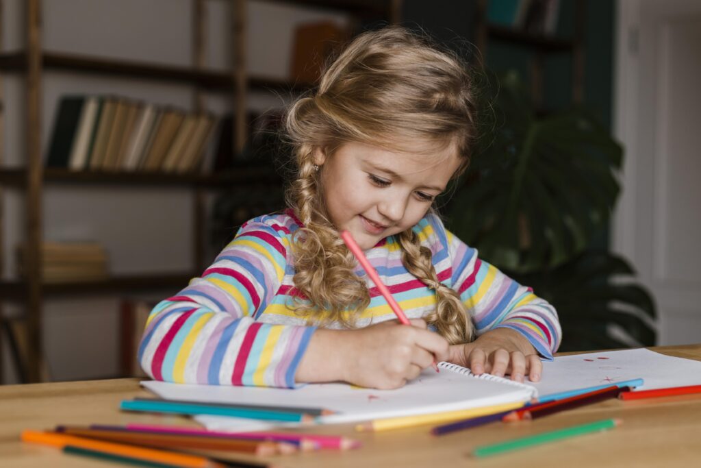 Girl writing in a book