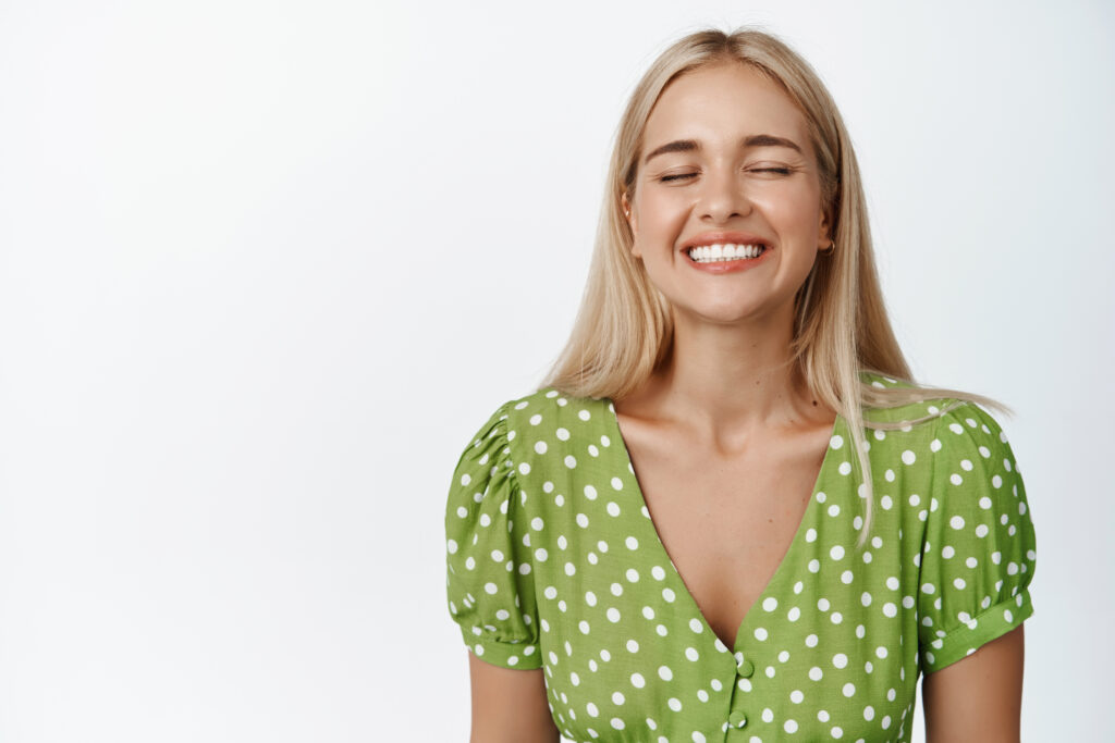 Happy woman in a green dress