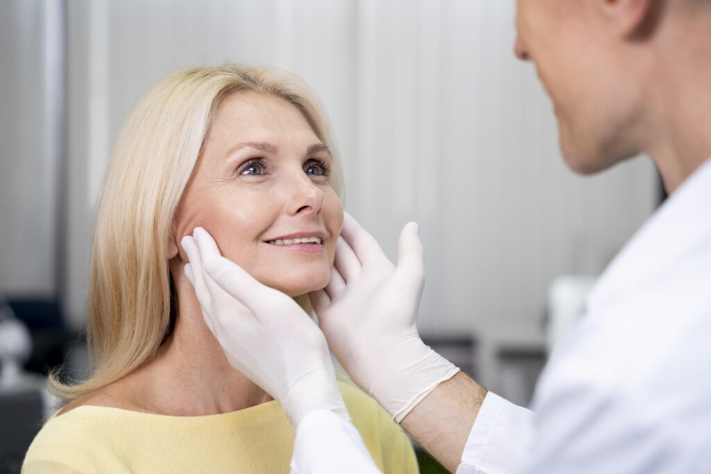 Close up of doctor checking patient's face