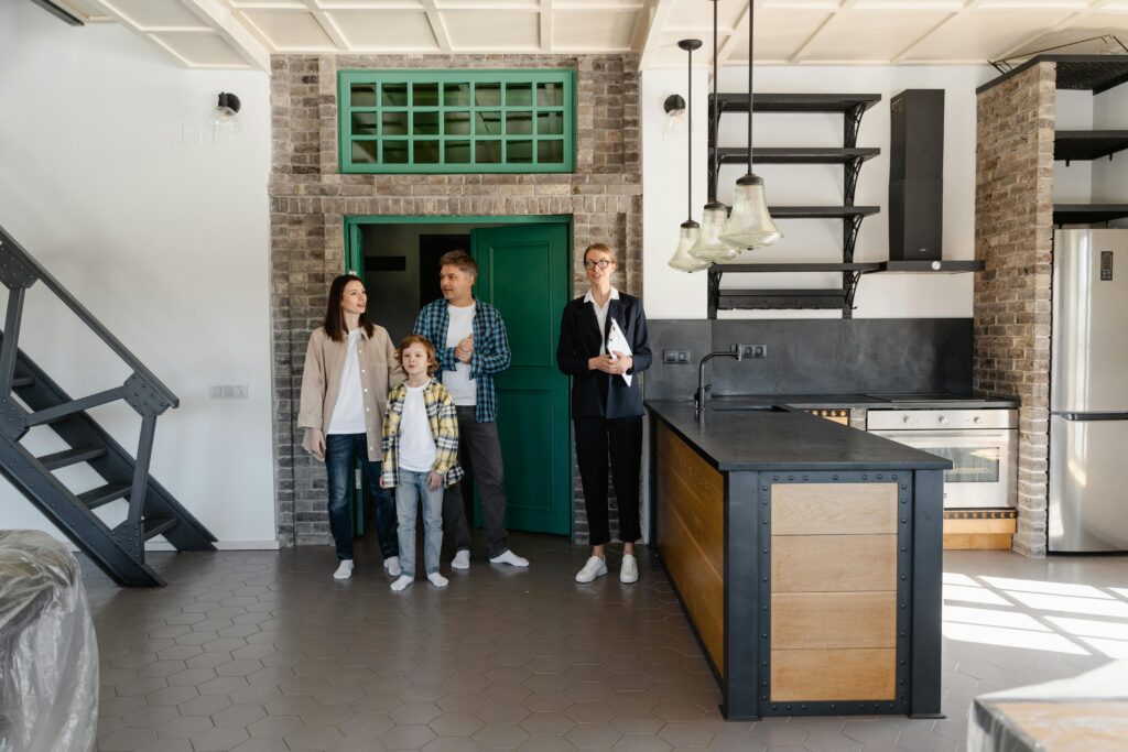 Sales agent showing family a house