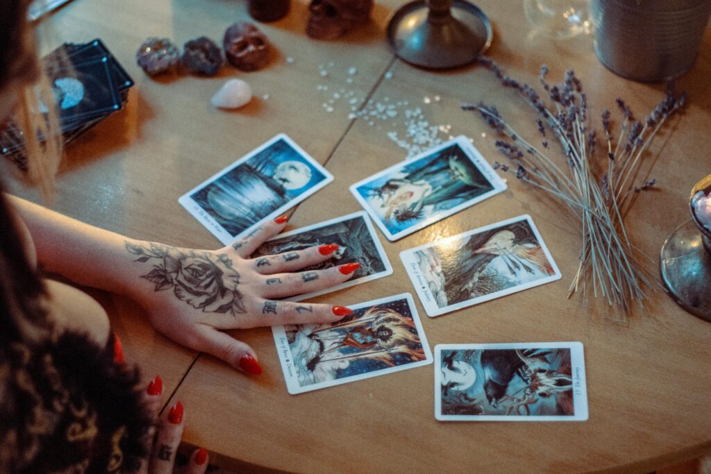 Anon person practicing tarot card reading