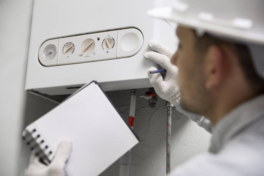 Worker repairing heat pump