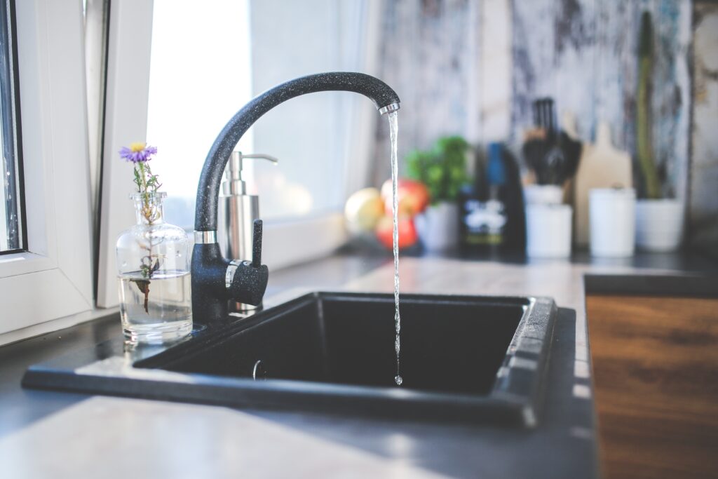 Water coming out of a kitchen tap sink