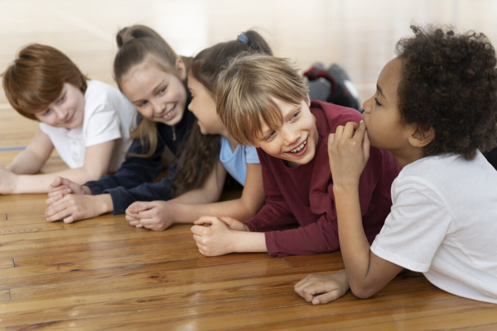Kids on floor chatting to each other