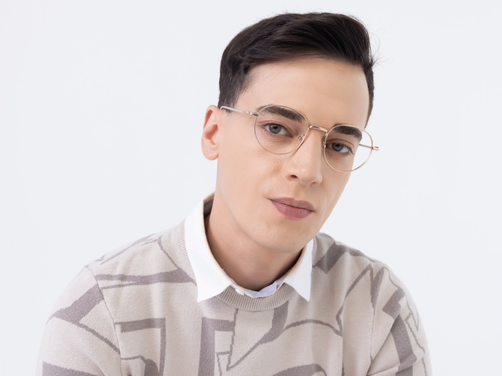 Man with black hair wearing glasses