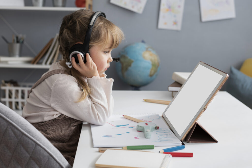 Female child learning from a tablet computer