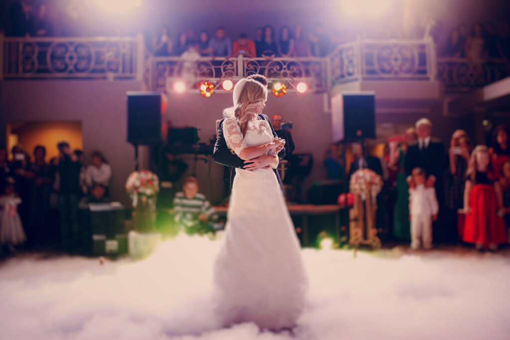 Couple hugging during their first dance at their wedding reception