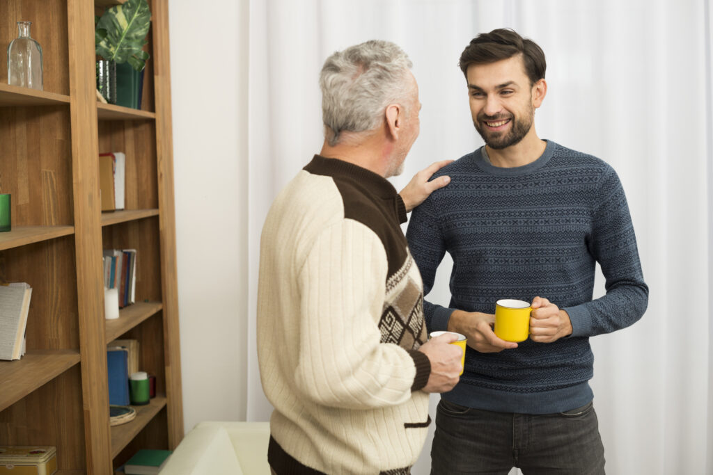 Older man reassuring younger man