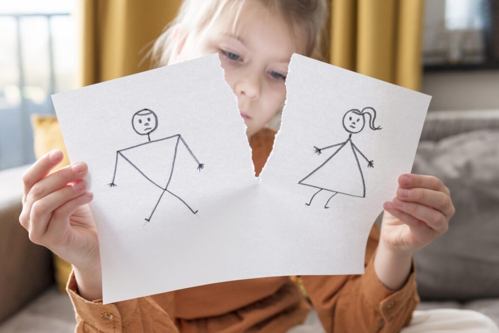 Girl tearing a paper page