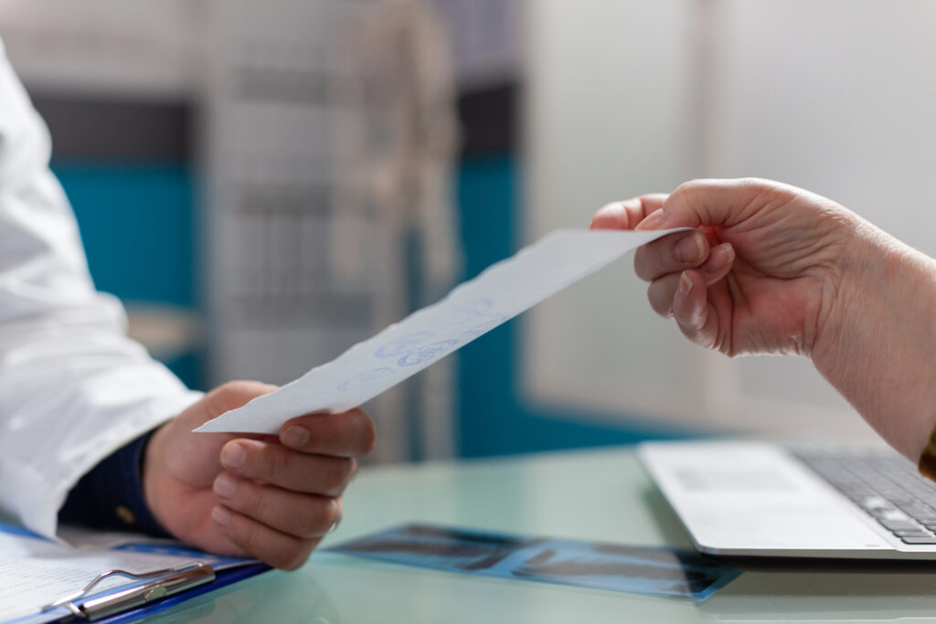 Doctor giving patient a prescription