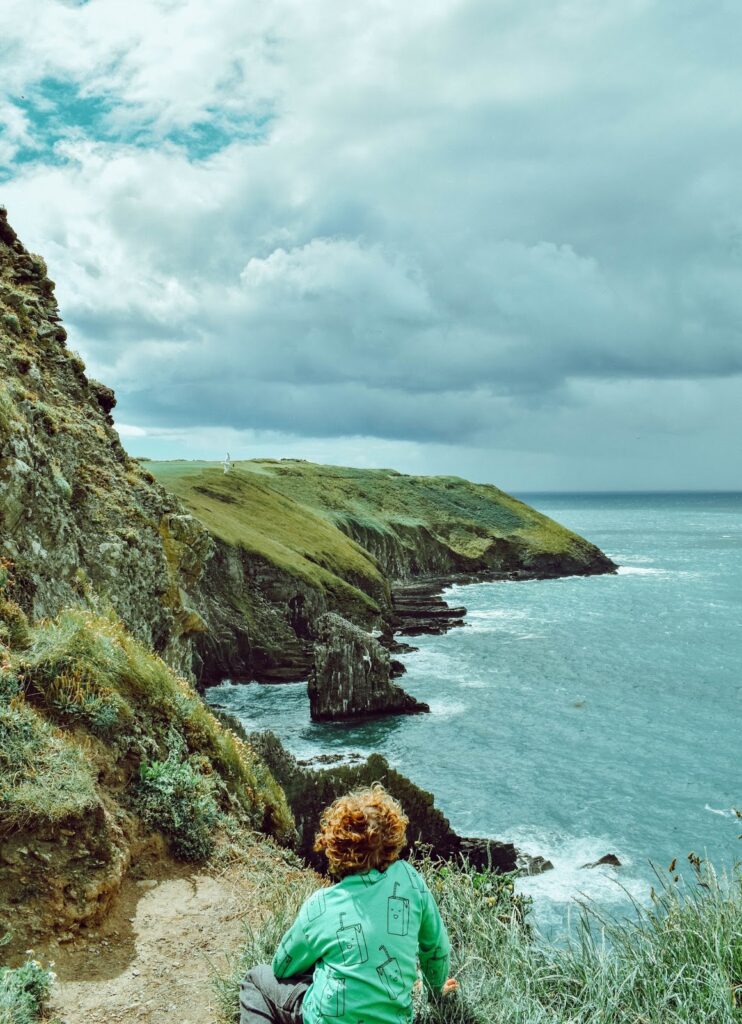Boy looking out from the Old Head of Kinsale