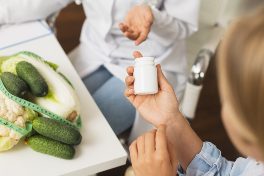 Anon person holding a pill container