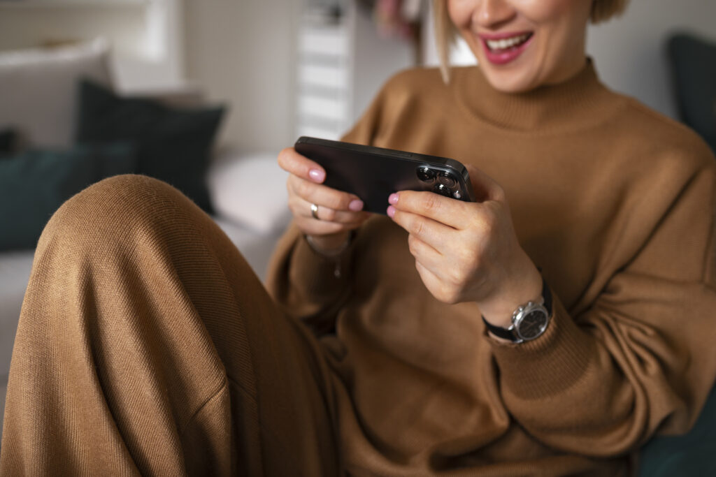 Anon woman playing a game on her mobile