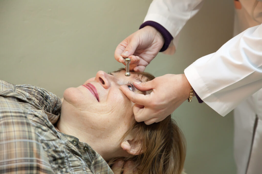 Doctor examining woman's eye