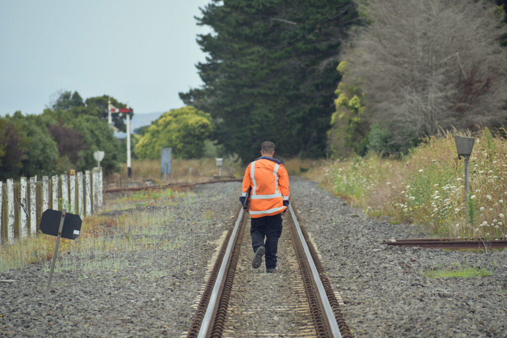 Railroad worker on railway tracks