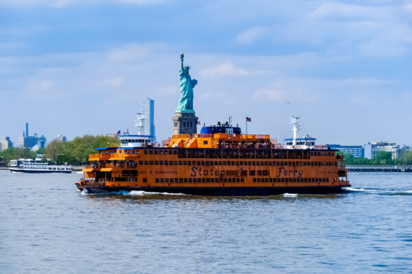 View of the Staten Island Ferry in front of the Statue of Liberty