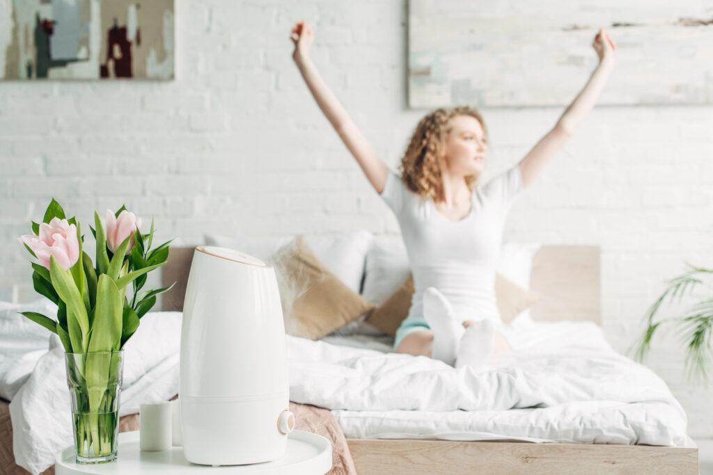 Woman in a beautiful bright bedroom